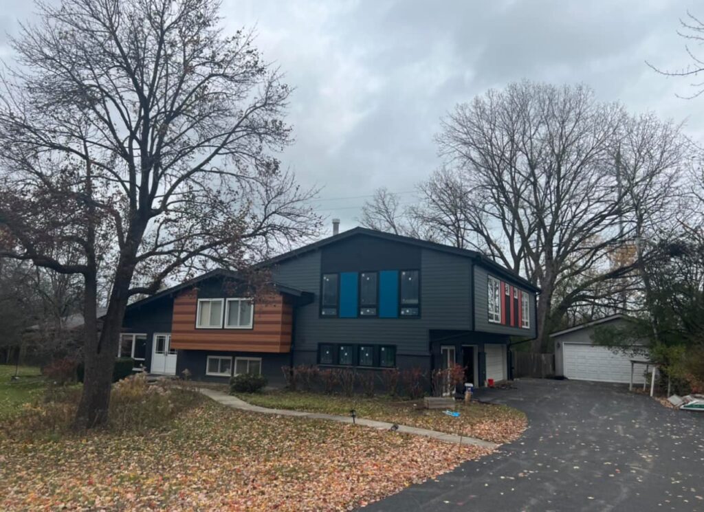 Home after complete roof replacement, new siding installation, and gutter upgrades by JSMM Inc