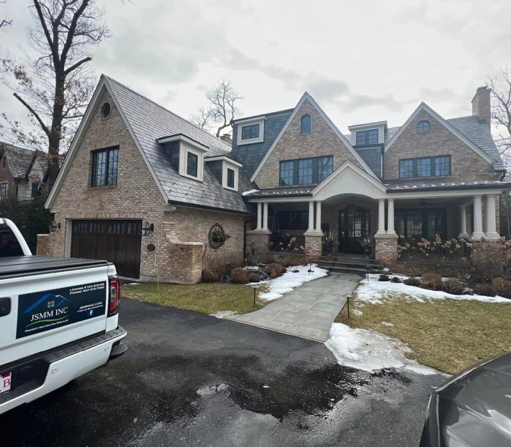 Luxury home after professional roof replacement, new siding, and window upgrades - enhanced curb appeal and weather protection